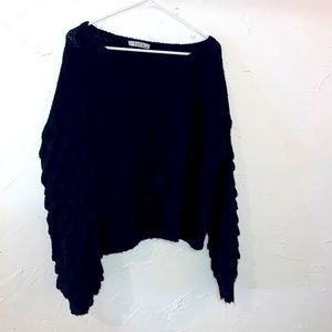 Black knit sweater with fun sleeves